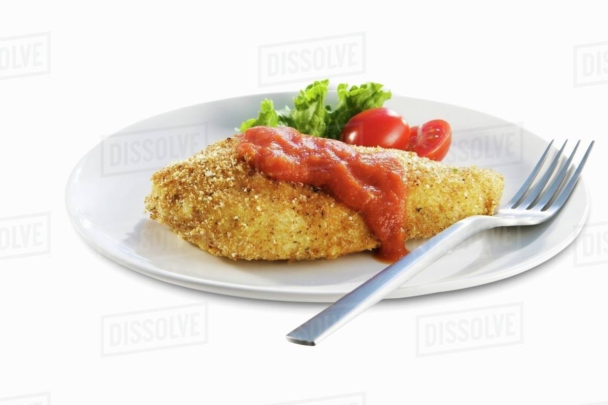 Breaded Baked Chicken Breast with Tomato Sauce Stock Photo Dissolve