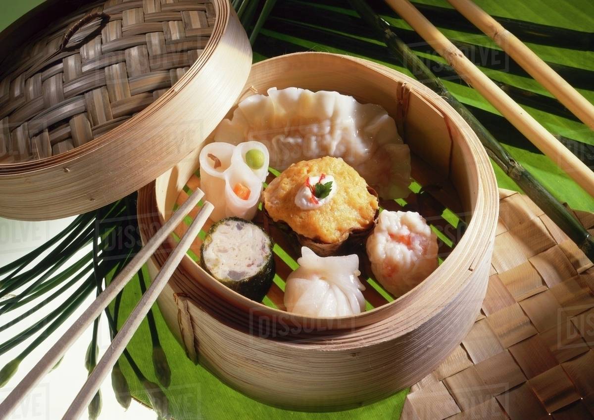 Assorted dim sum in a steaming basket Stock Photo Dissolve