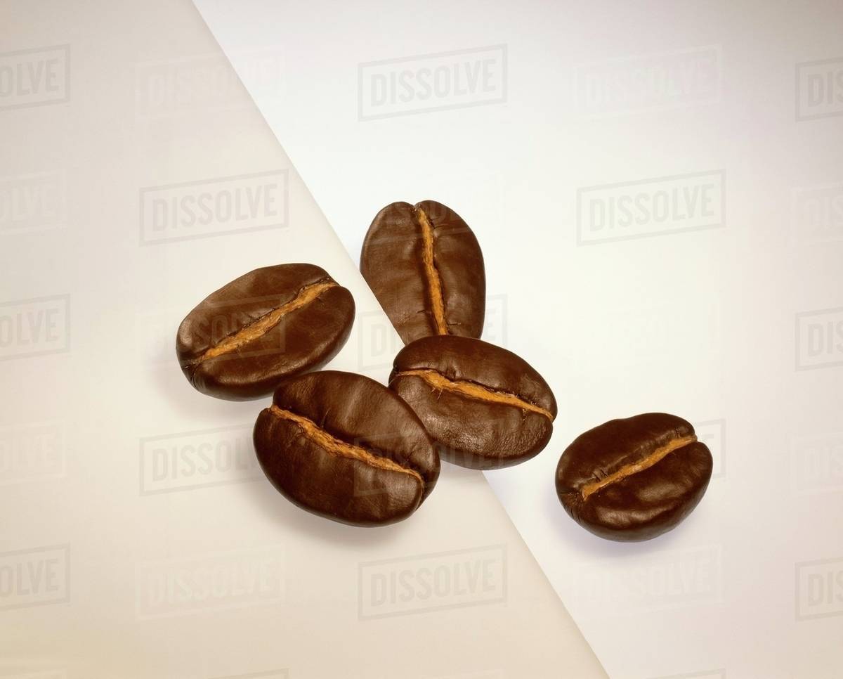 Five coffee beans Stock Photo Dissolve