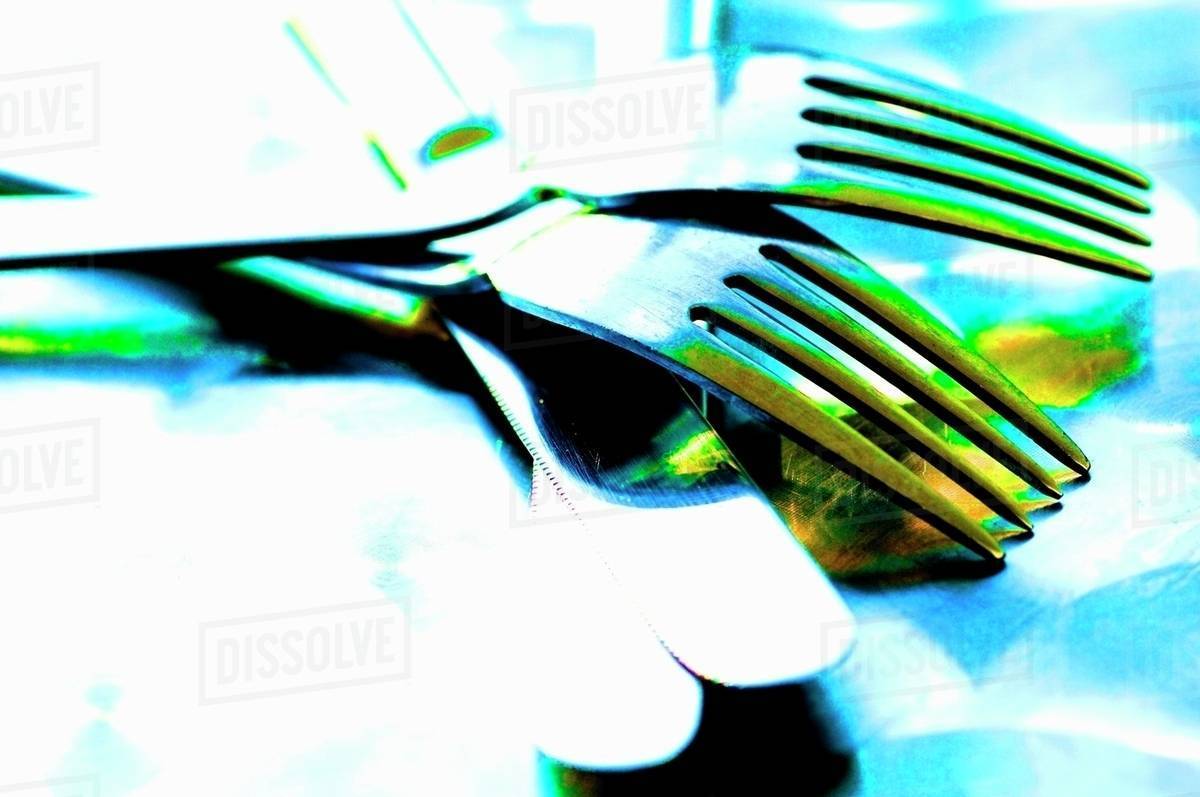 Knives and forks Stock Photo Dissolve