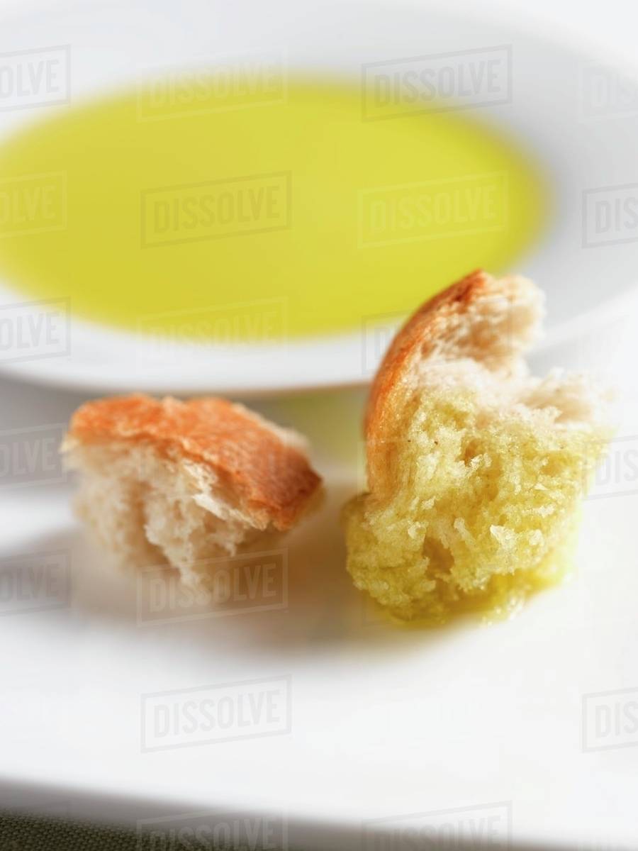 Crusty Bread with Olive Oil for Dipping Stock Photo Dissolve