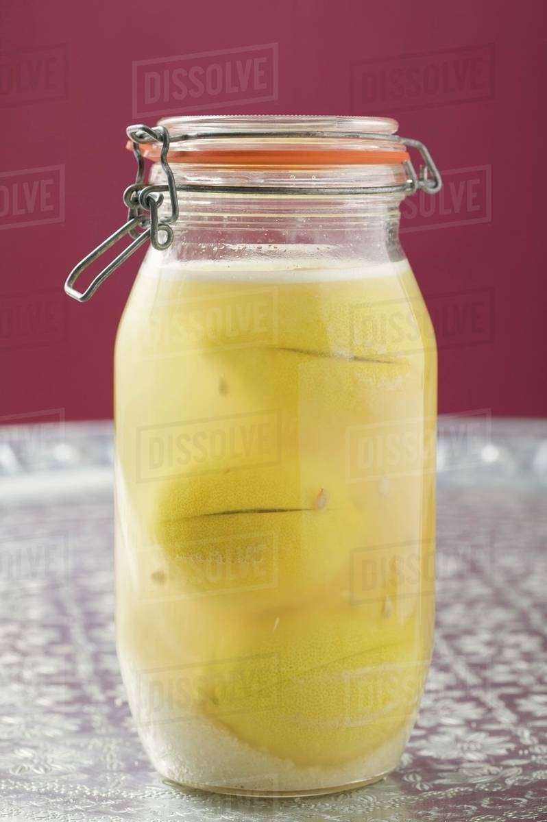 Pickled lemons in jar Stock Photo Dissolve