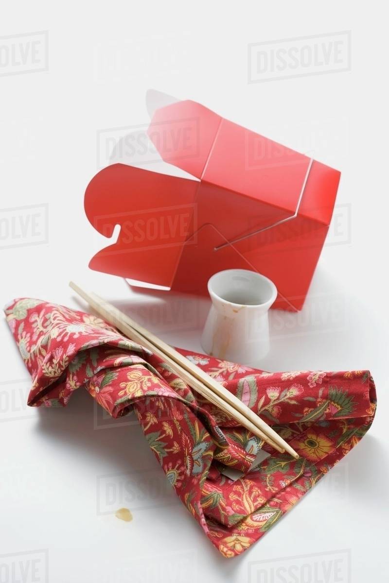 Empty takeaway container, chopsticks, napkin Stock Photo Dissolve