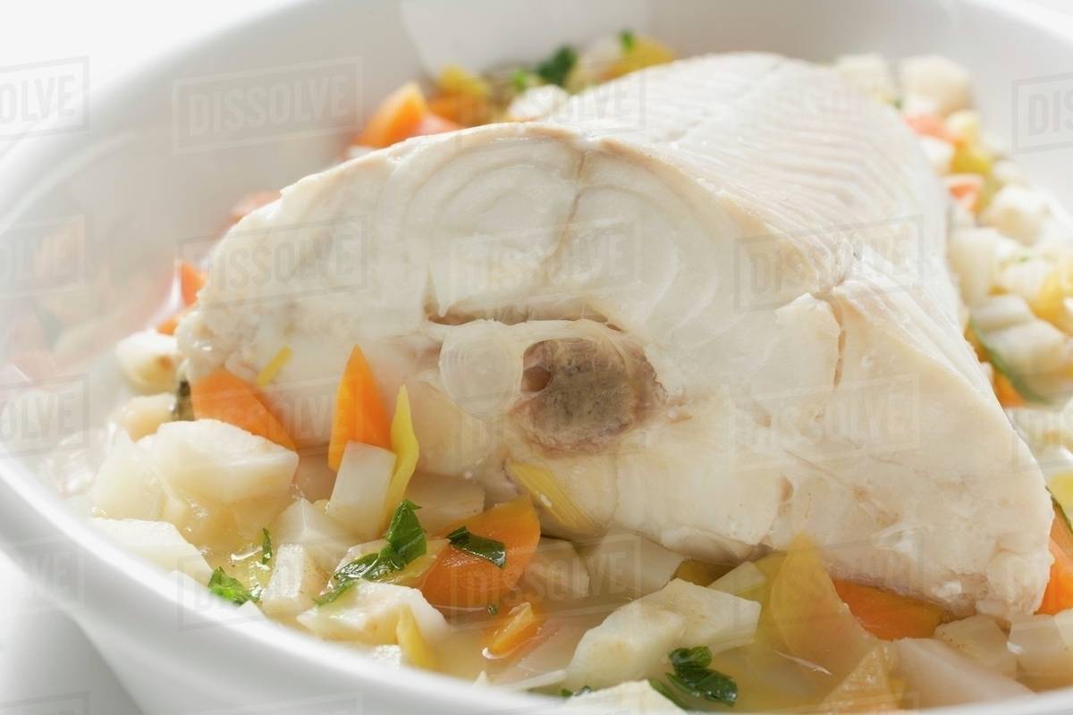 Fish on root vegetables Stock Photo Dissolve