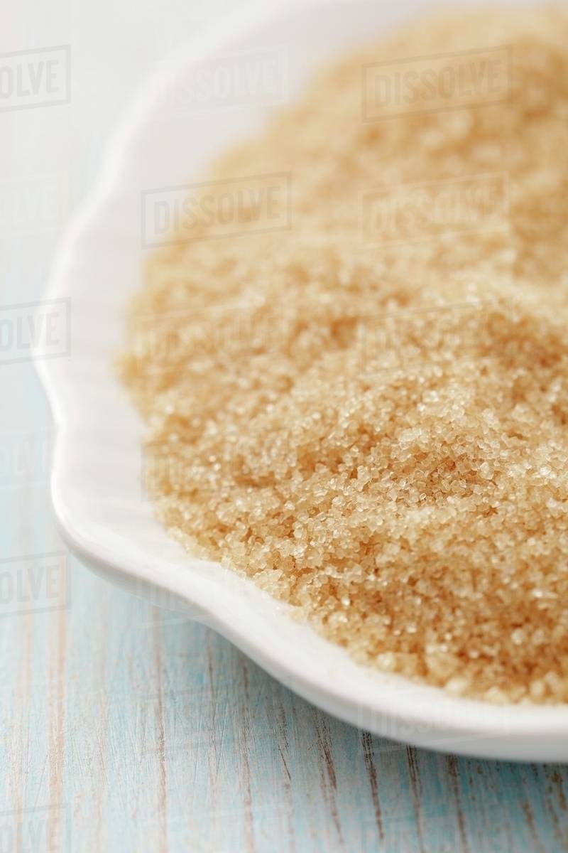 Brown cane sugar Stock Photo Dissolve