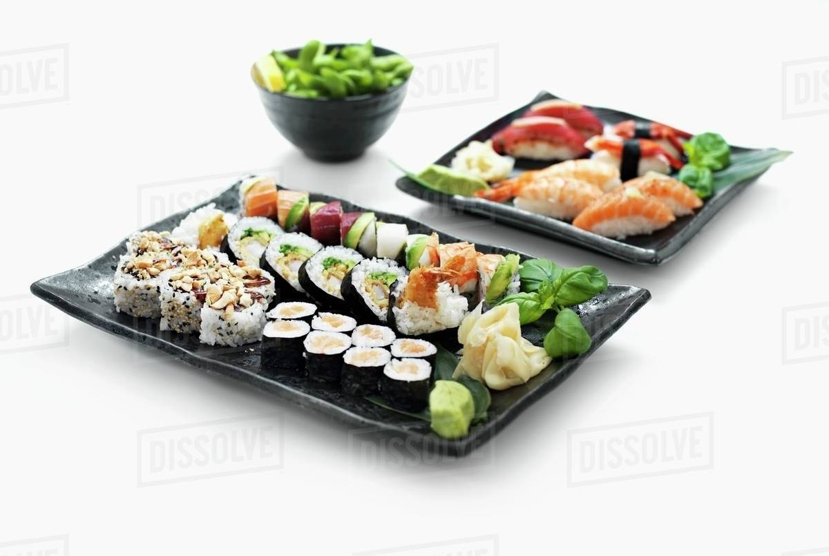 Two sushi platters with wasabi and ginger Stock Photo Dissolve