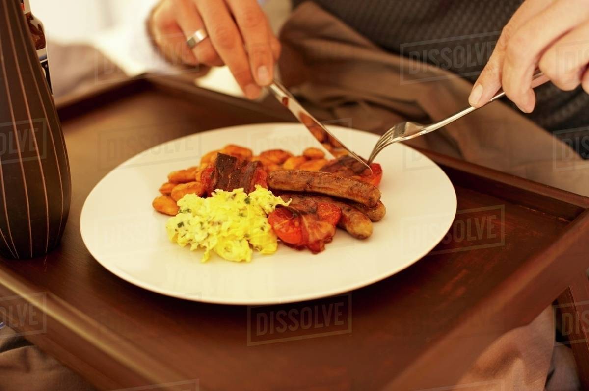 An English Breakfast With Scrambled Eggs Baked Beans Tomatoes Bacon And Sausages Stock Photo Dissolve
