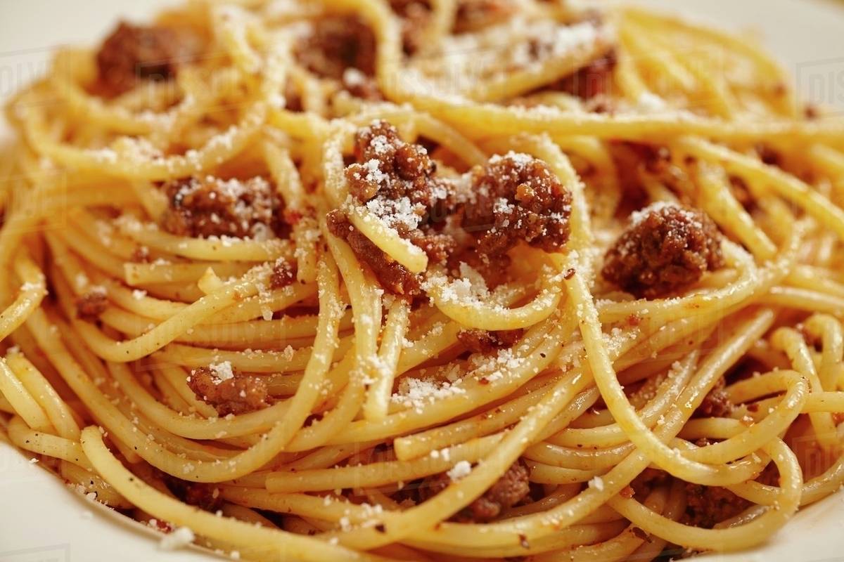 Spaghetti with a minced meat sauce and Parmesan (closeup) Stock