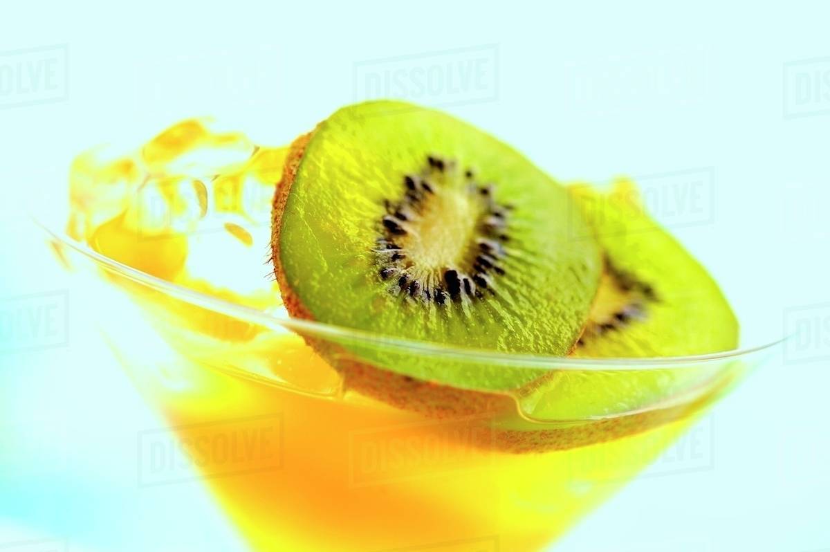 Frozen daiquiri with carrots and kiwis Stock Photo Dissolve