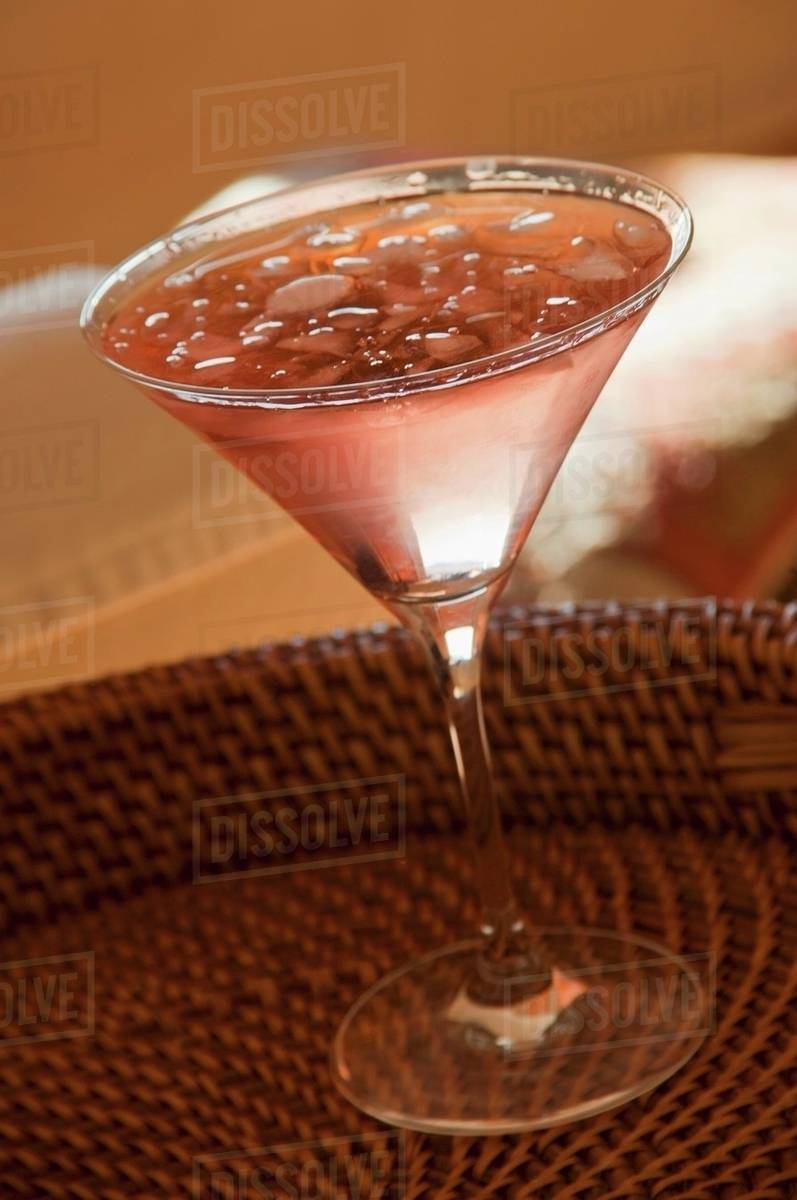 A Cosmopolitan cocktail on a cork tray Stock Photo Dissolve