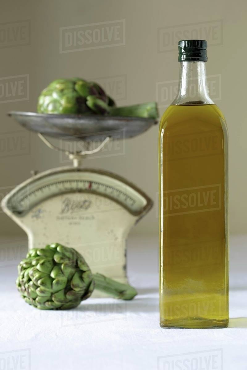 Olive oil and artichokes Stock Photo Dissolve