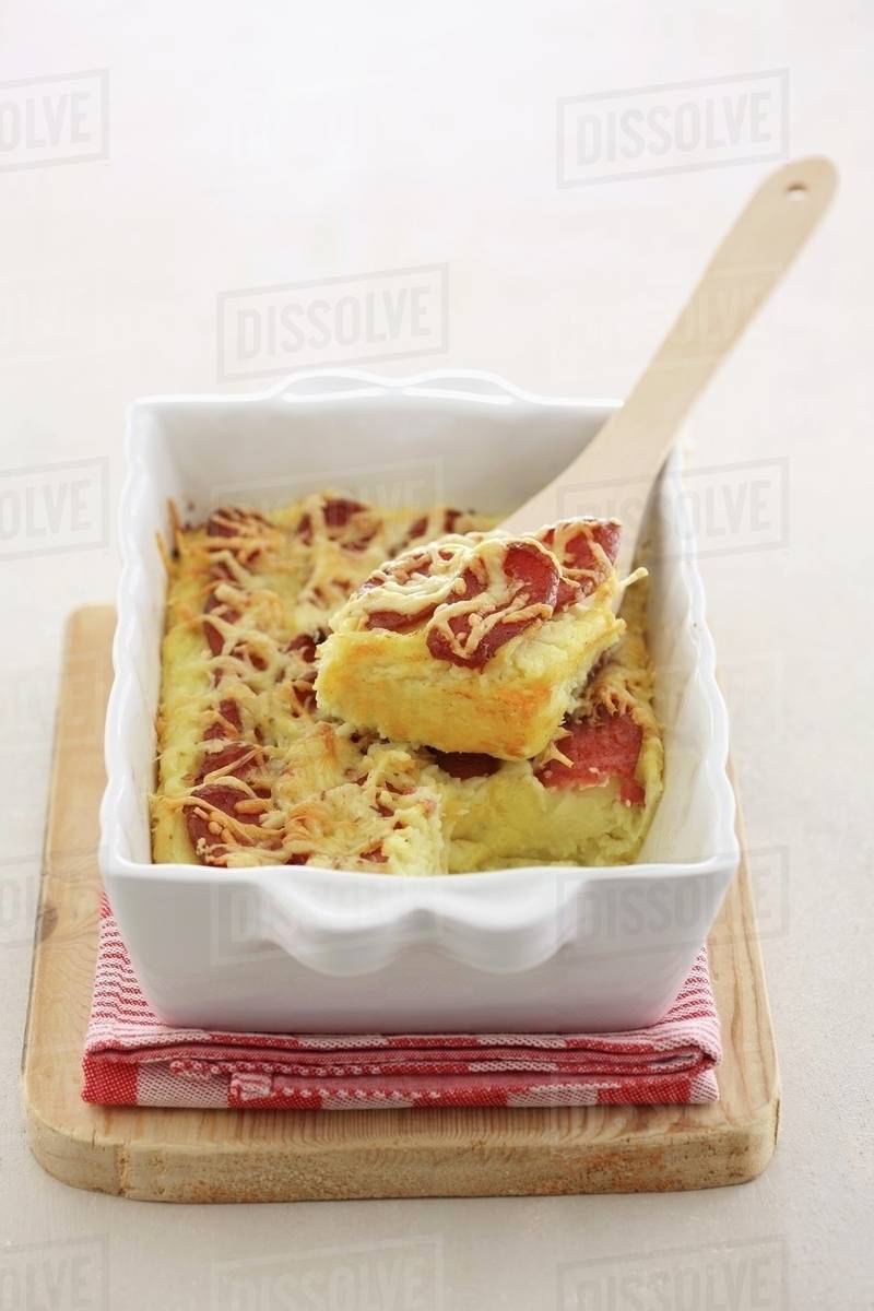 Potato bake with sausage and cheese Stock Photo Dissolve