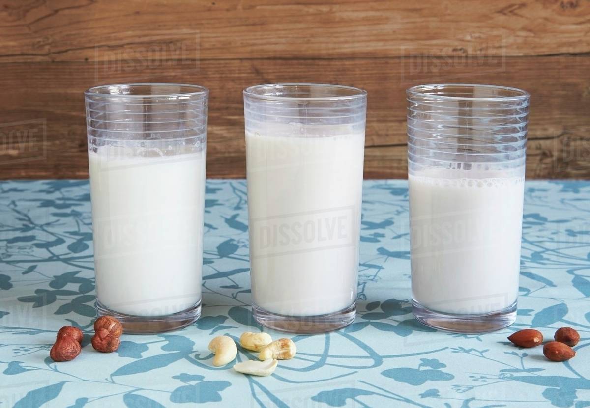 Hazelnut milk, cashew nut milk and almond milk Stock Photo Dissolve