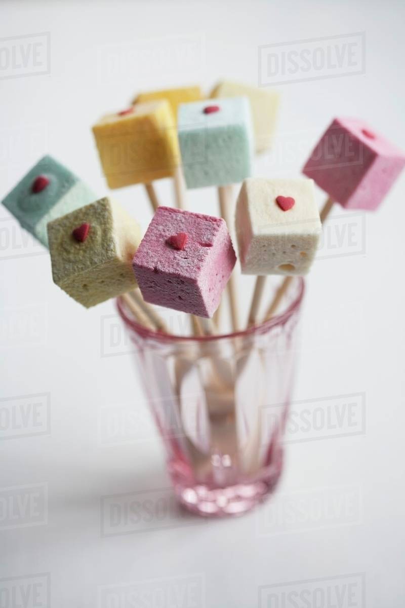 Marshmallow skewers with sugar hearts Stock Photo Dissolve