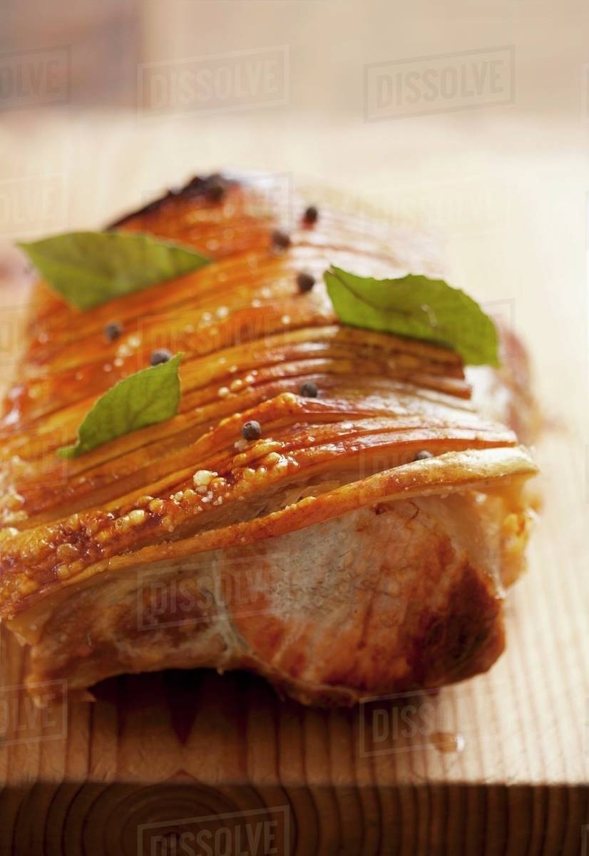 Crispy, roasted cutlets with allspice leaves and allspice berries