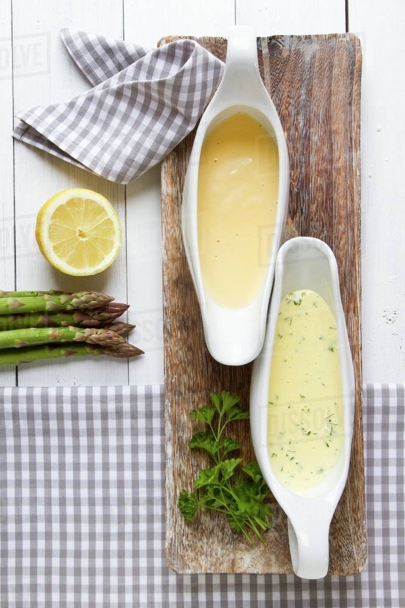 Two sauces served with asparagus Stock Photo Dissolve
