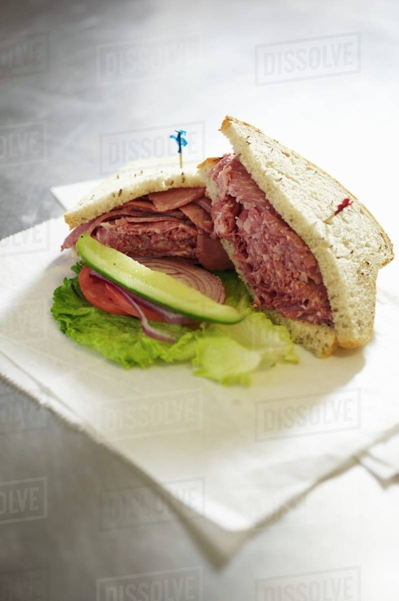 Corned Beef Sandwich on Rye with a Pickle Stock Photo Dissolve