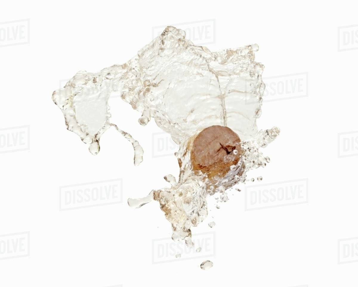 A splash of white wine with a cork Stock Photo Dissolve