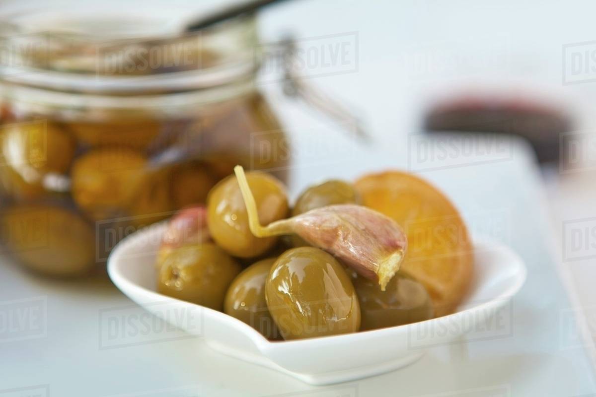 Pickled olives with garlic Stock Photo Dissolve