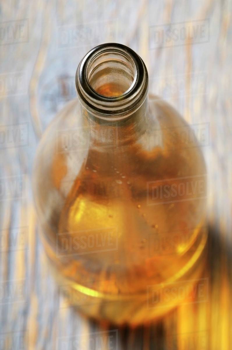 A bottle of white wine, opened Stock Photo Dissolve