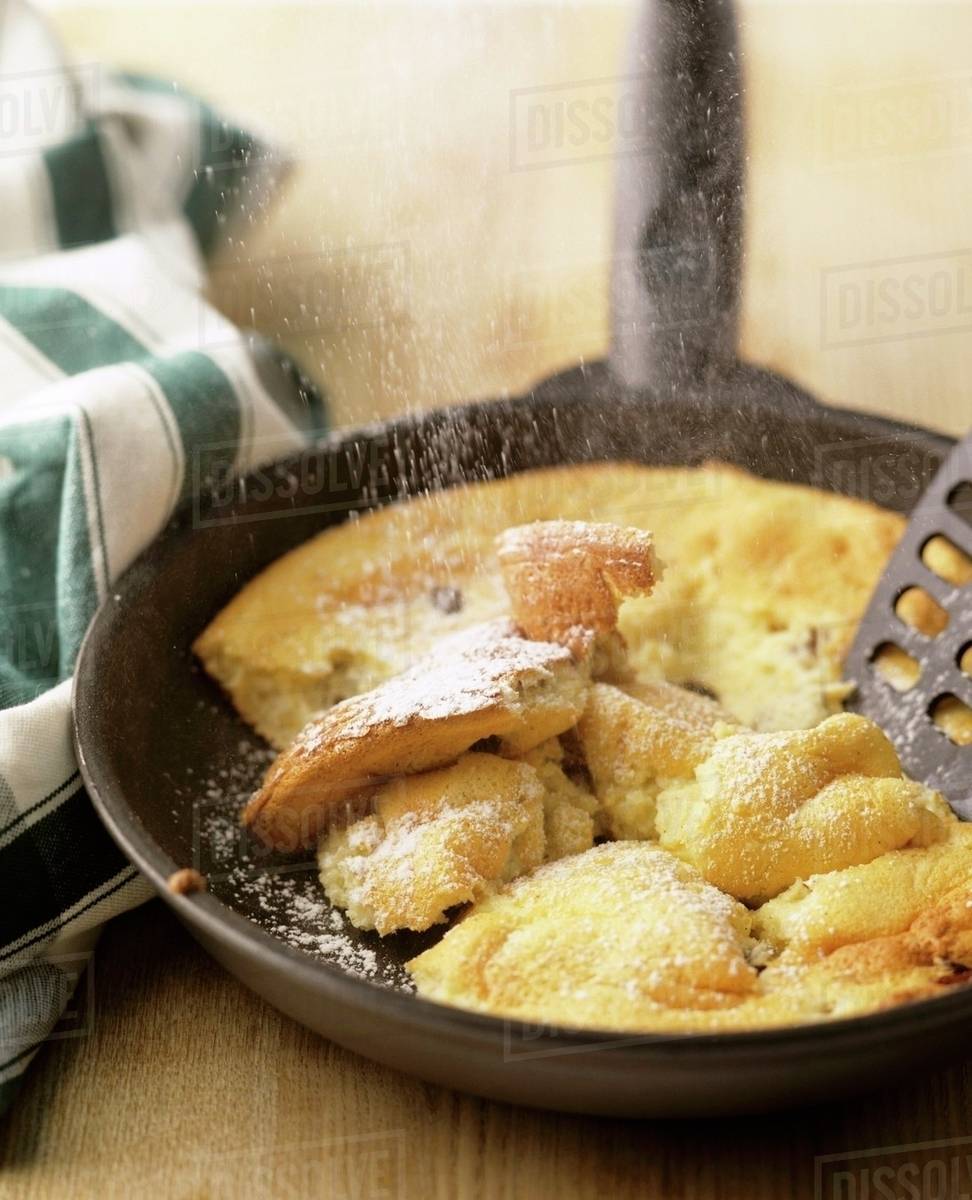 Kaiserschmarren (shredded pancake) in frying pan Stock Photo Dissolve