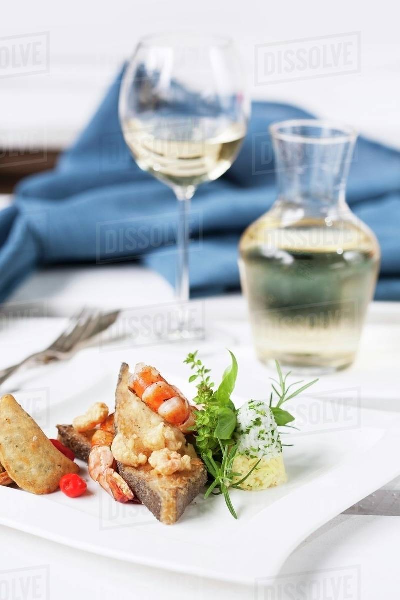 Deepfried halibut with prawns and rice Stock Photo Dissolve