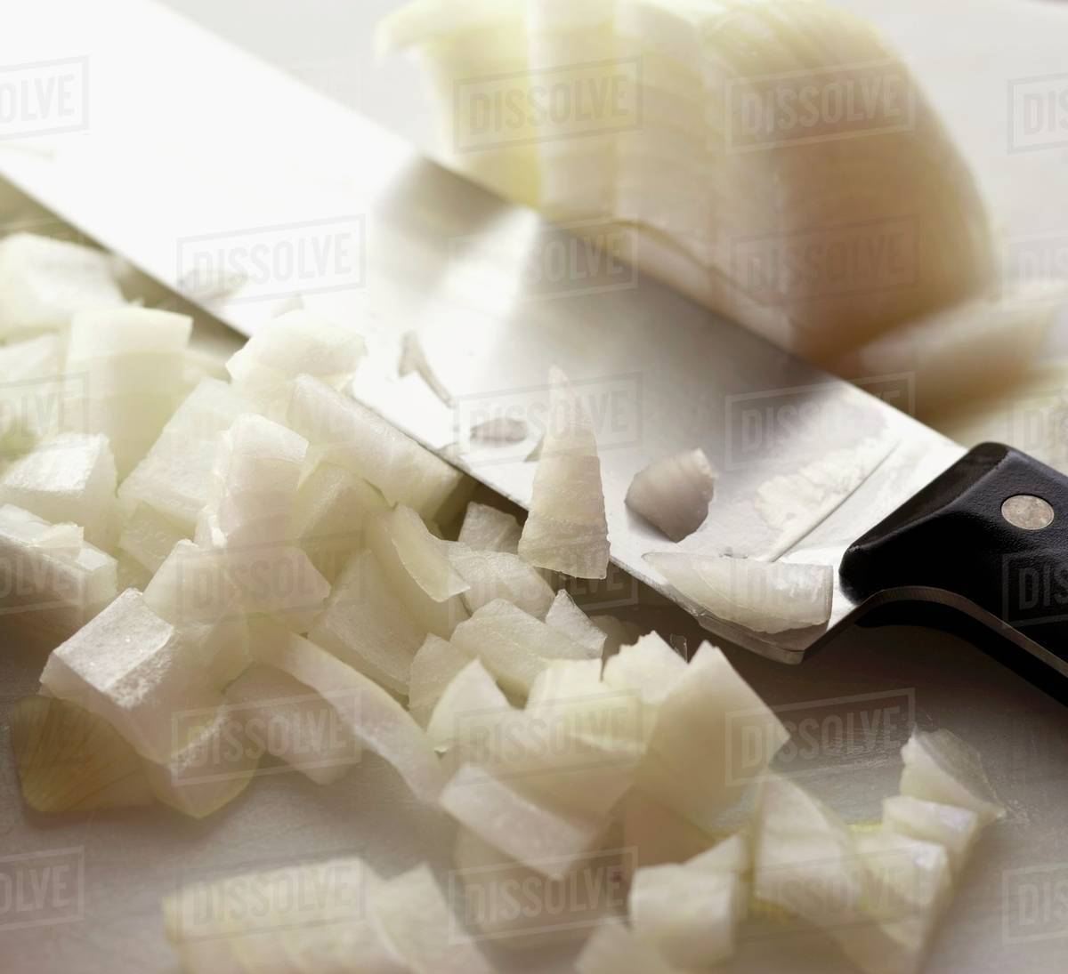 Knife with Chopped Onions Stock Photo Dissolve