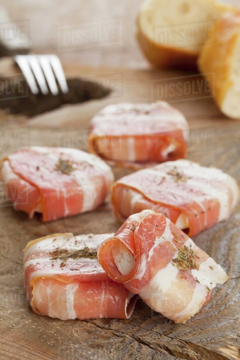 Young goat's cheese wrapped in bacon with herbes de Provence Stock