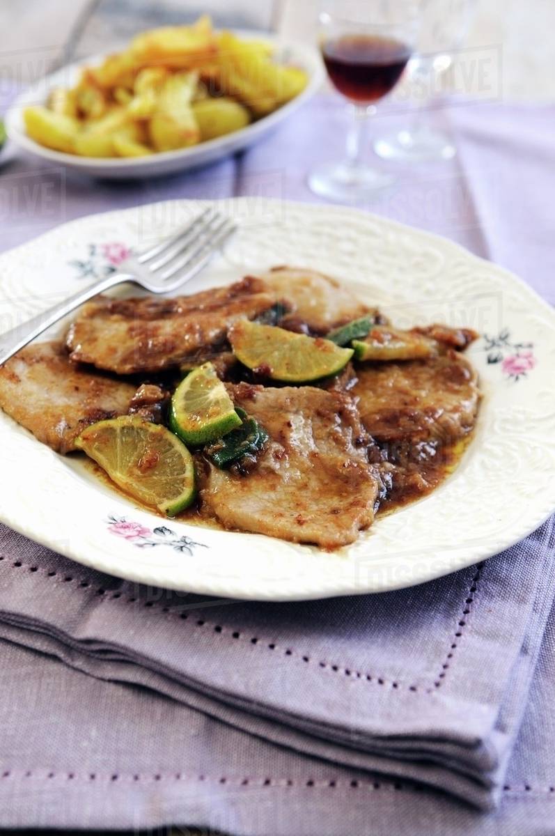Veal escalopes with a lime, sage and Marsala wine sauce Stock Photo