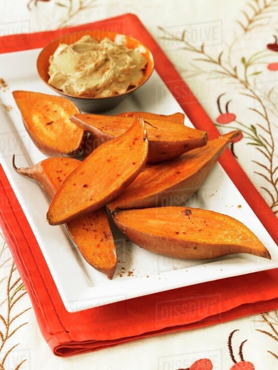 Roasted Sweet Potatoes with Cinnamon Butter Stock Photo Dissolve