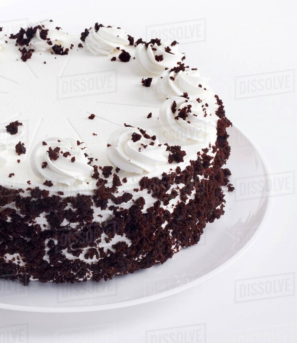 White Frosted Cake with Chocolate Crumbs Stock Photo Dissolve