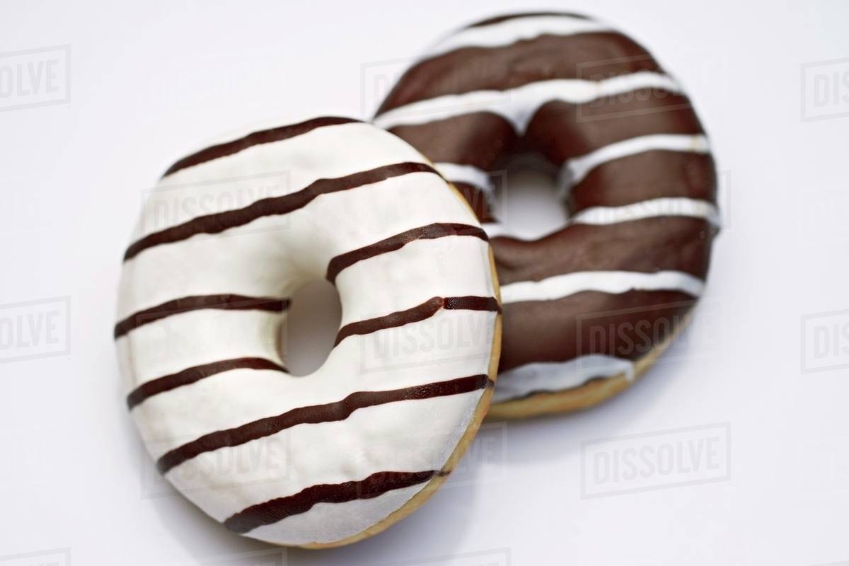 Two black and white doughnuts Stock Photo Dissolve