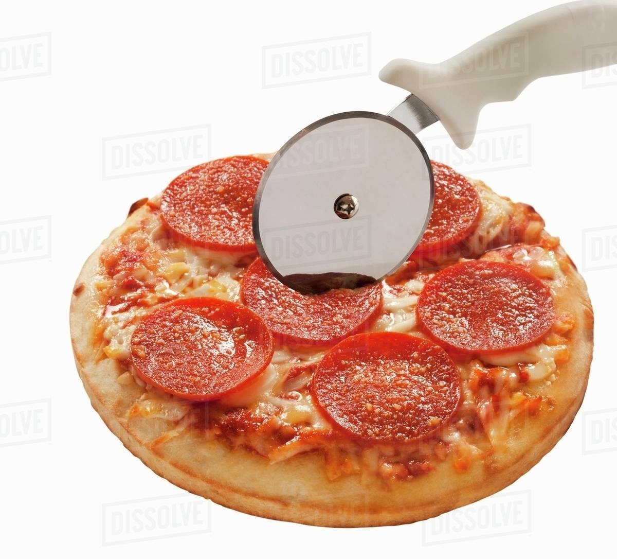 Mini Pepperoni Pizza with Pizza Cutter Stock Photo Dissolve