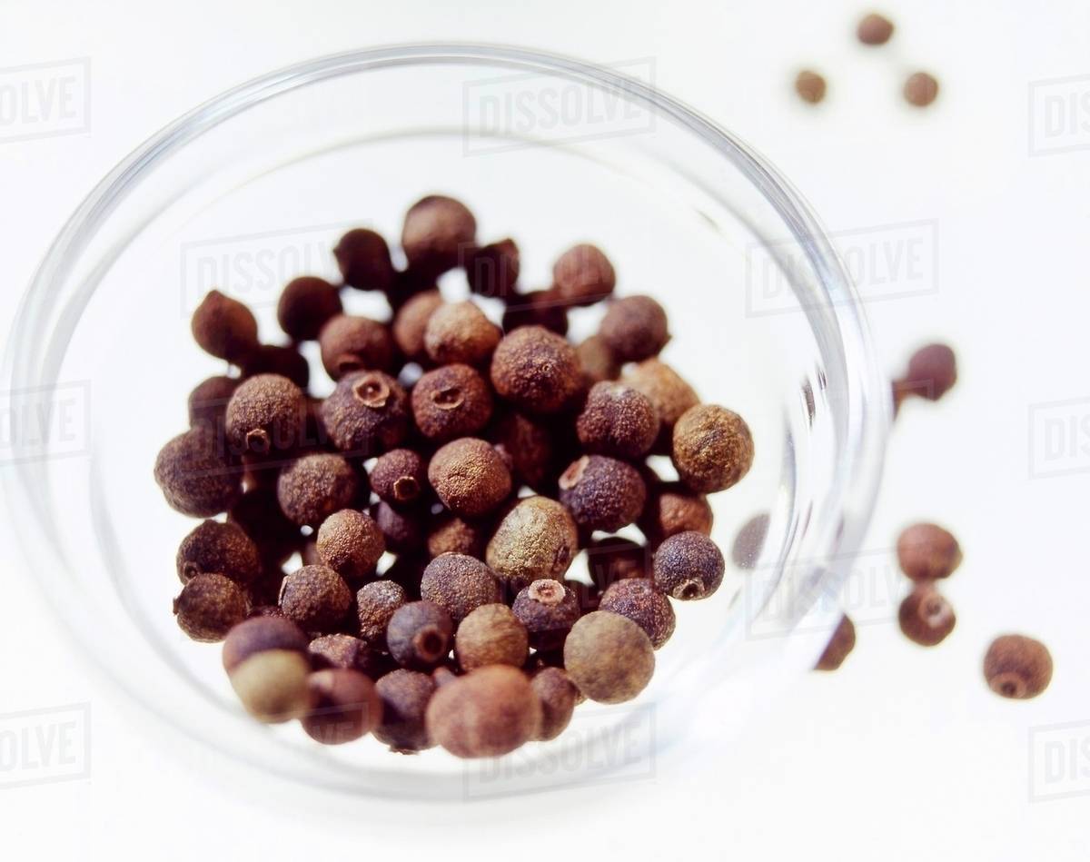 Allspice berries in a glass dish Stock Photo Dissolve