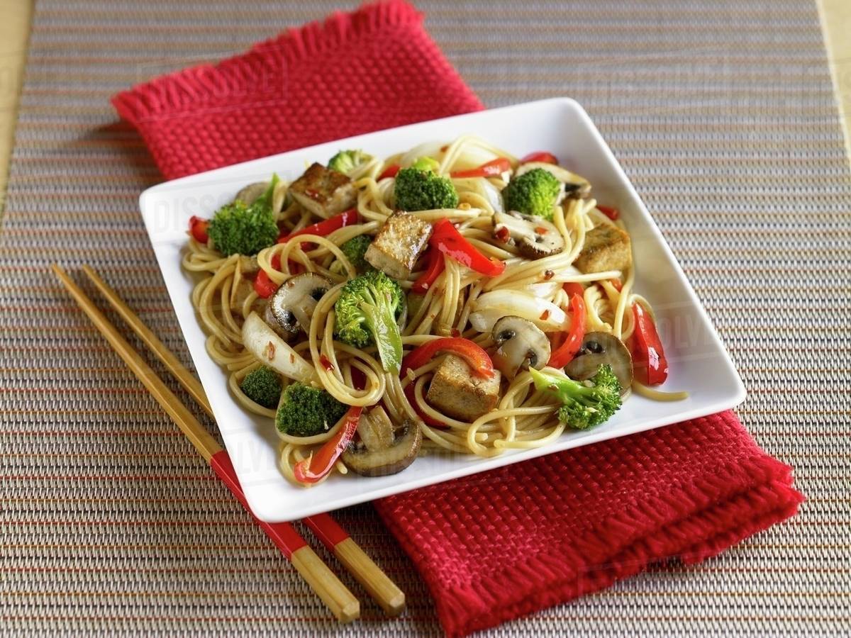 Tofu and Vegetable Stir Fry with Noodles Stock Photo Dissolve