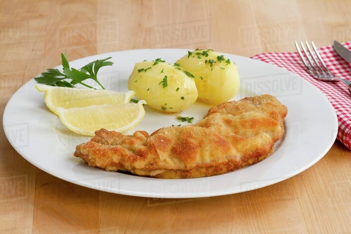 Wiener Schnitzel (breaded veal escalope) with parsley potatoes Stock