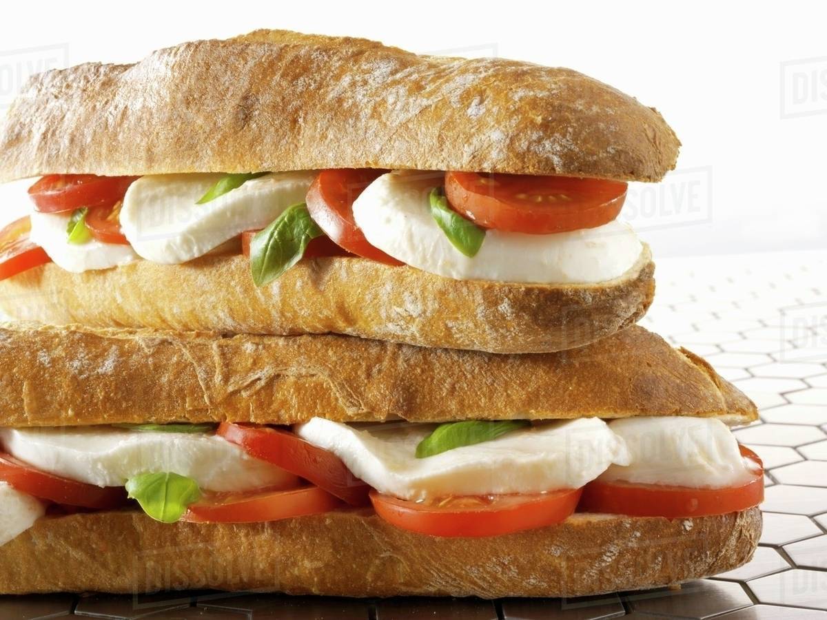 Two mozzarella and tomato baguettes Stock Photo Dissolve
