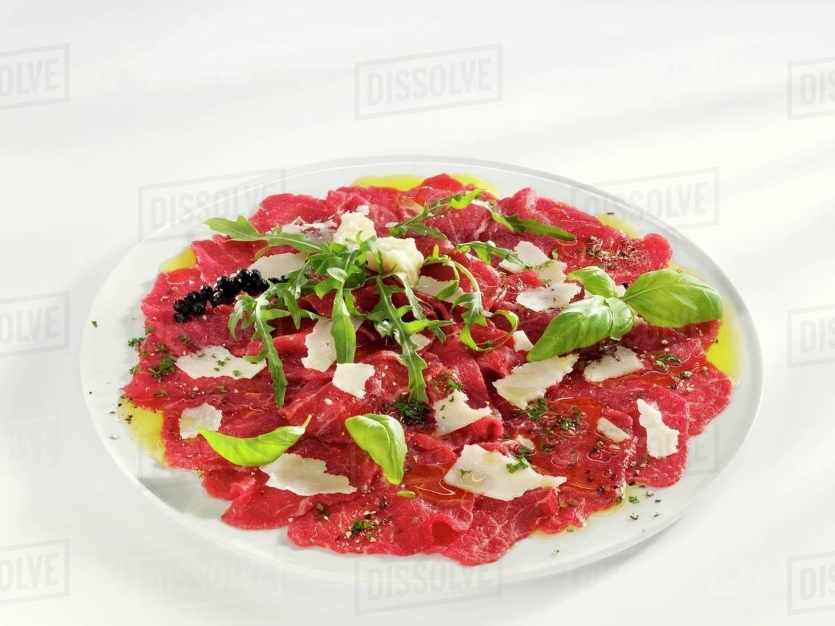 Carpaccio (Raw, marinated beef fillet, Italy) Stock Photo Dissolve