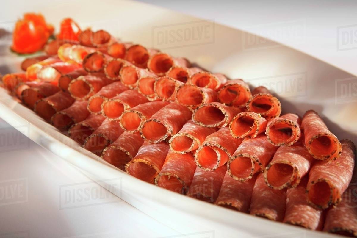 Platter of peppered salami Stock Photo Dissolve