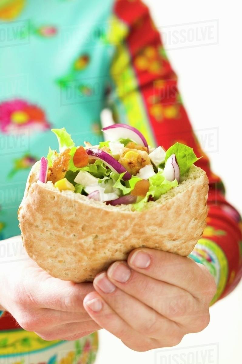 Pita bread filled with vegetables and roast turkey breast Stock Photo