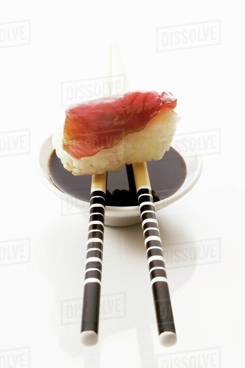 Tuna nigiri sushi with soy sauce Stock Photo Dissolve