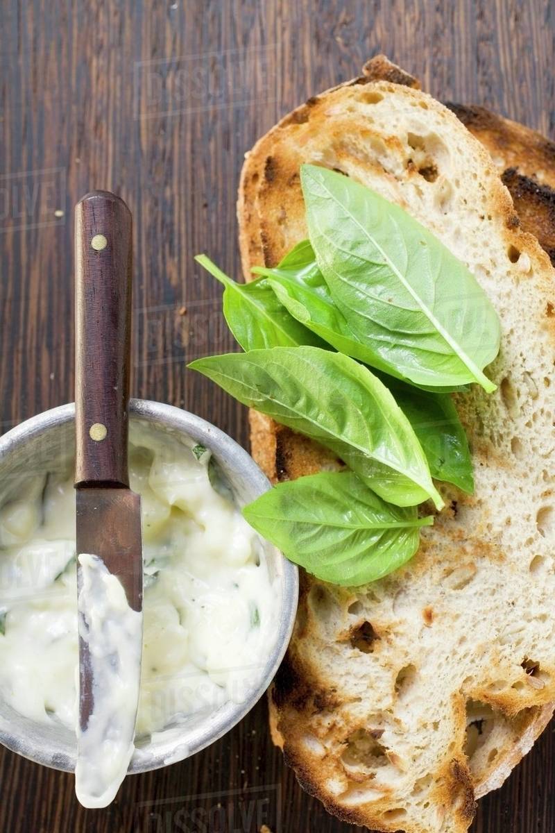 Basil mayonnaise and toasted bread Stock Photo Dissolve