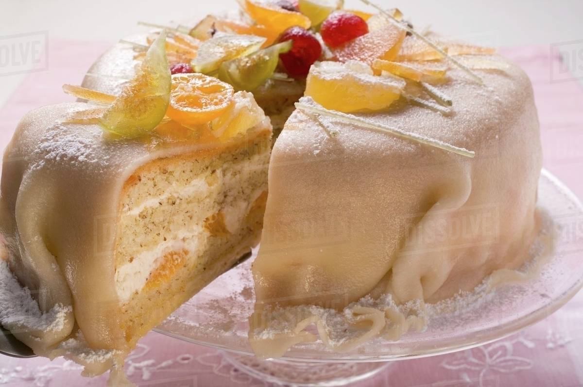 Marzipancovered cake with candied fruit Stock Photo Dissolve