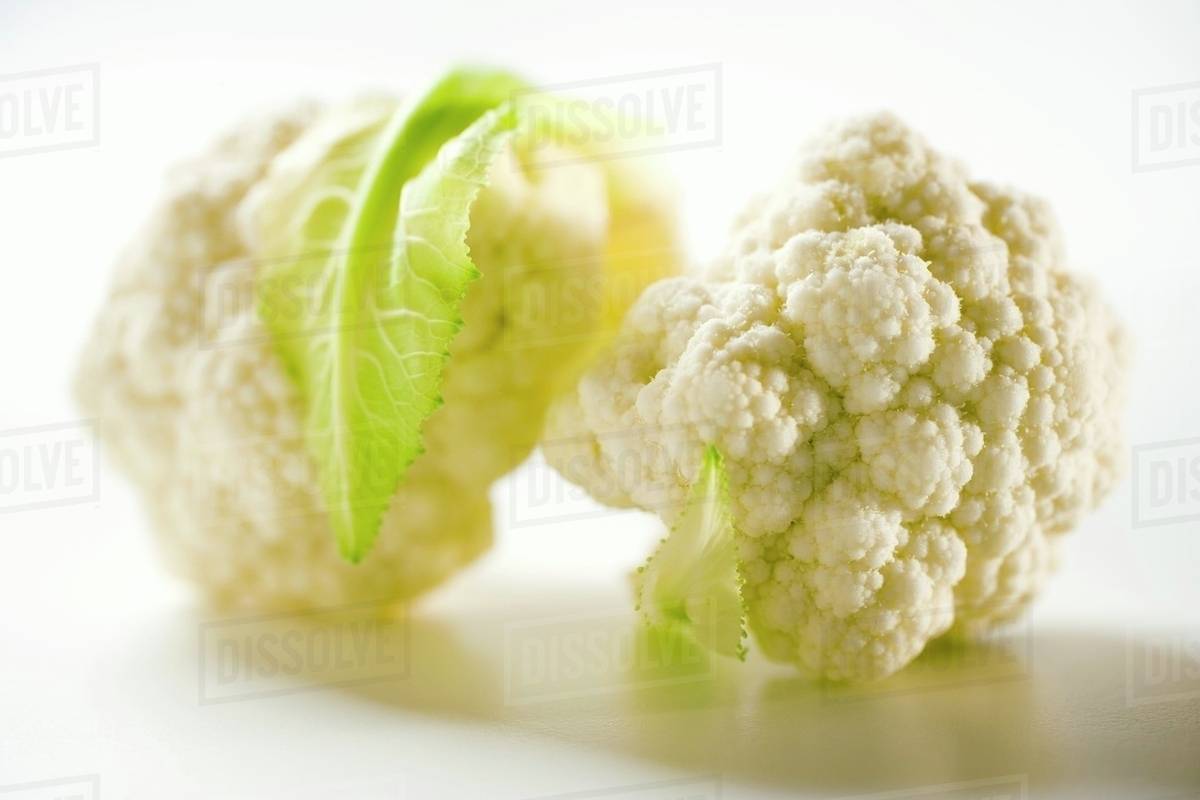 Two cauliflower florets Stock Photo Dissolve