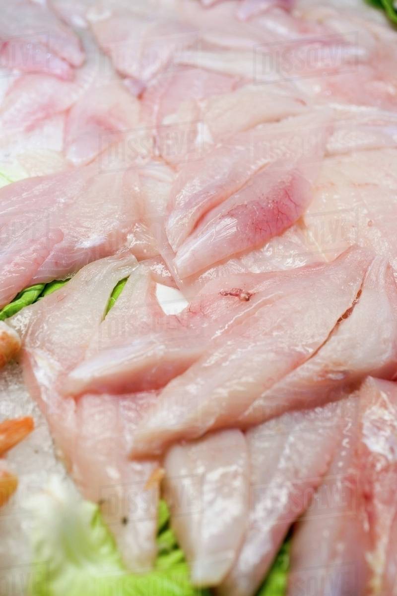 Fresh fish fillets on ice Stock Photo Dissolve