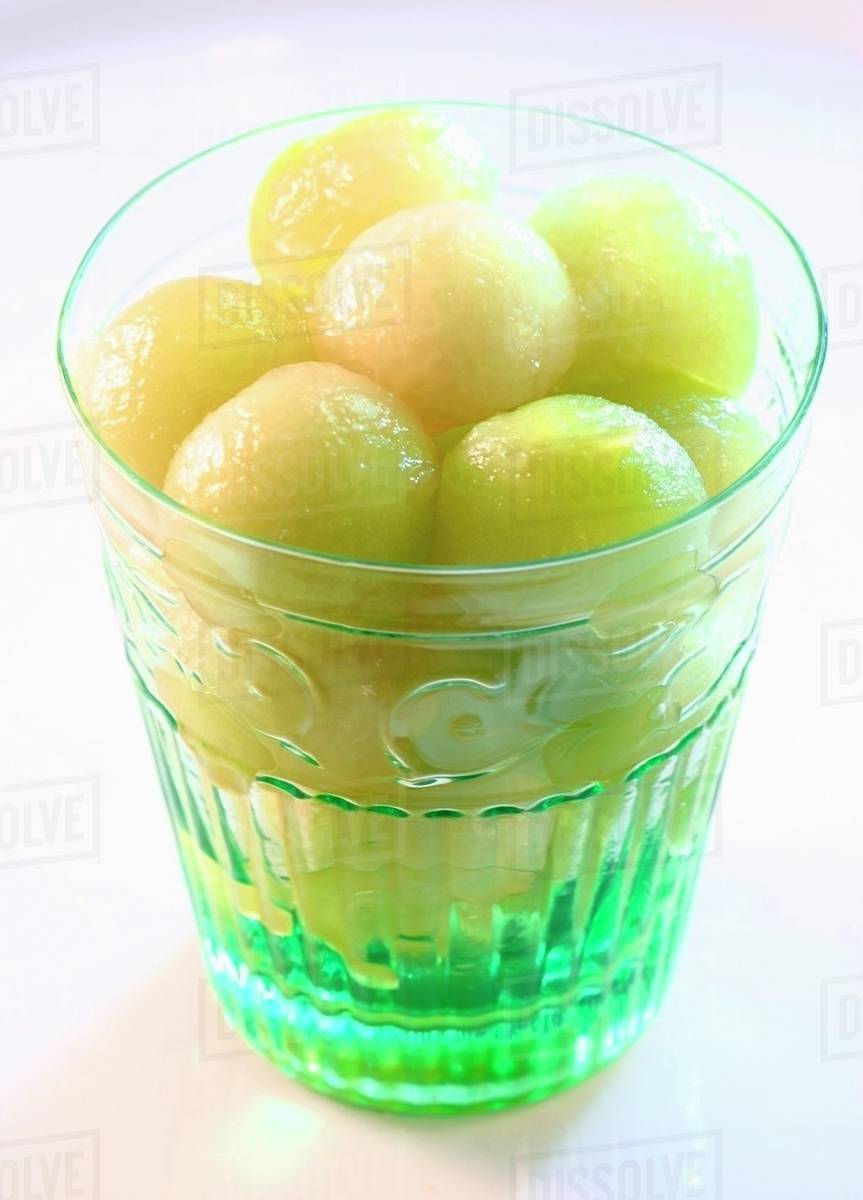 Honeydew melon balls in glass Stock Photo Dissolve