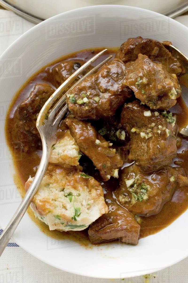 Beef goulash with bread dumpling Stock Photo Dissolve