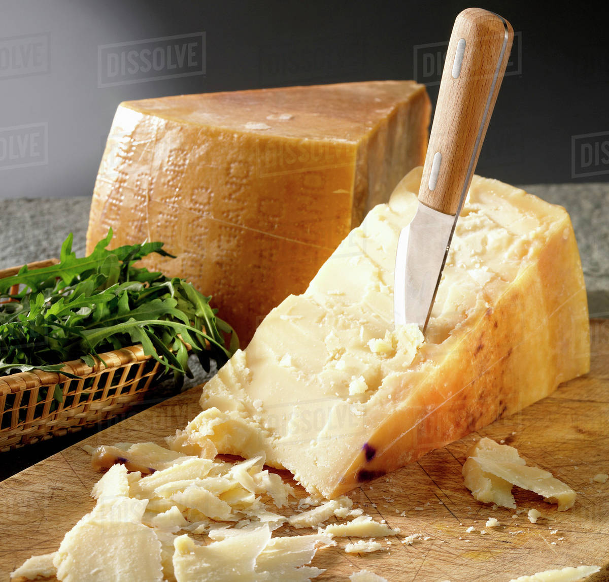 Parmesan with a cheese knife Stock Photo Dissolve
