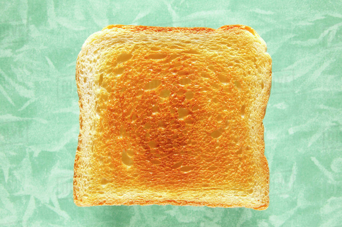 Slice of toast, closeup, elevated view Stock Photo Dissolve