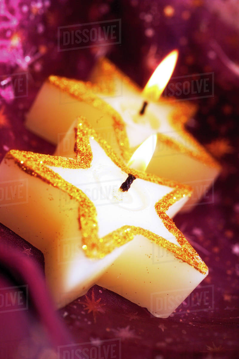Burning Christmas candle Stock Photo Dissolve